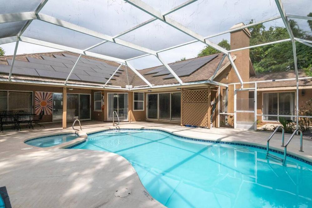 Tropical Escape with Relaxing Heated Pool & Palm Breezes